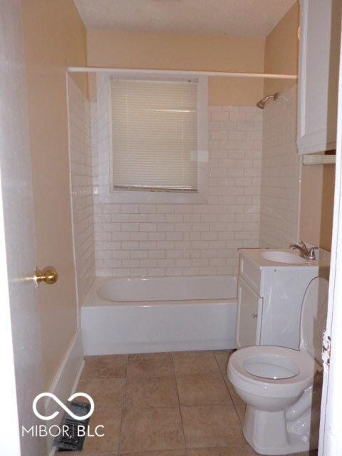 2250 N Goodlet Ave, Indianapolis, IN 46222 - full bathroom with tile patterned floors, tub / shower combination, and vanity