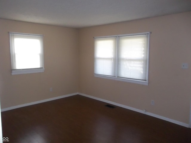2250 N Goodlet Ave, Indianapolis, IN 46222 - spare room with baseboards and wood finished floors