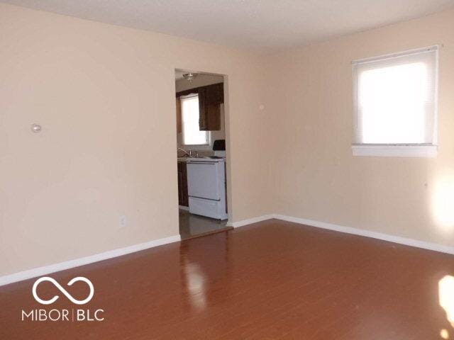 2250 N Goodlet Ave, Indianapolis, IN 46222 - unfurnished room featuring baseboards and wood finished floors