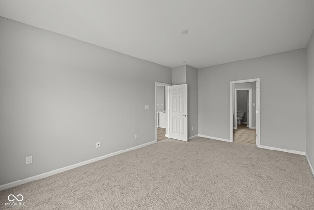 12500 Morning Ridge Way, Noblesville, IN 46060 - unfurnished bedroom featuring baseboards, carpet flooring, and ensuite bathroom
