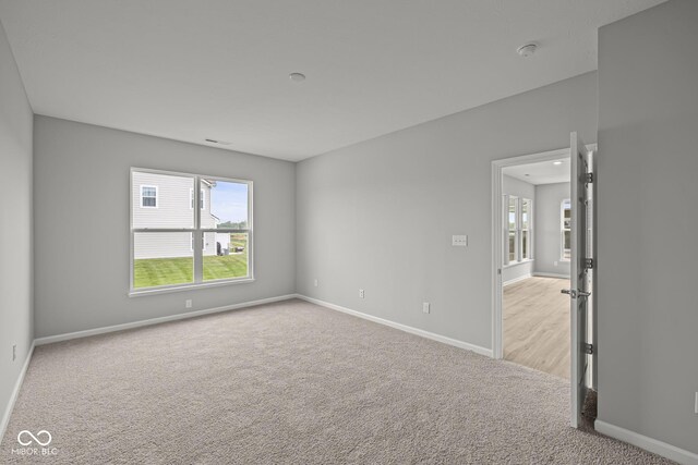 12500 Morning Ridge Way, Noblesville, IN 46060 - spare room with light colored carpet, baseboards, and healthy amount of natural light