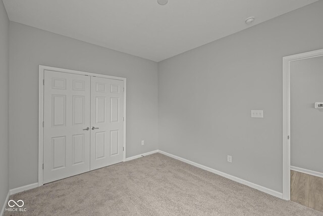 12500 Morning Ridge Way, Noblesville, IN 46060 - unfurnished bedroom with carpet flooring, a closet, and baseboards