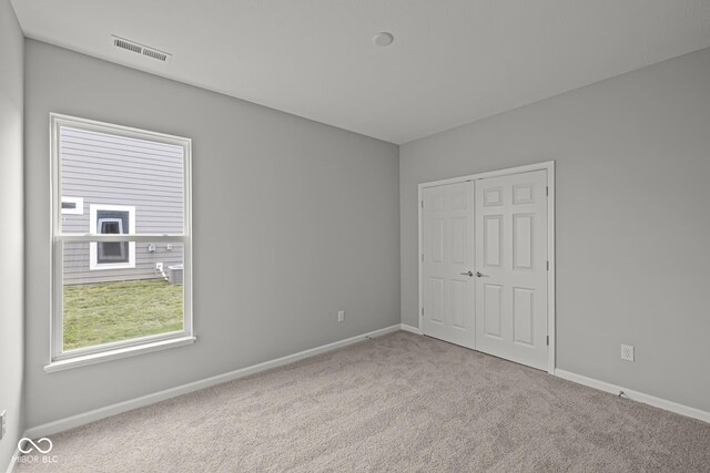 12500 Morning Ridge Way, Noblesville, IN 46060 - unfurnished bedroom with baseboards, carpet floors, and a closet