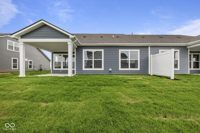 12500 Morning Ridge Way, Noblesville, IN 46060 - rear view of property featuring roof with shingles, a yard, and a patio area