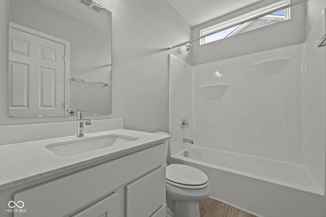 12500 Morning Ridge Way, Noblesville, IN 46060 - full bathroom with vanity, toilet, shower / bath combination, and wood finished floors