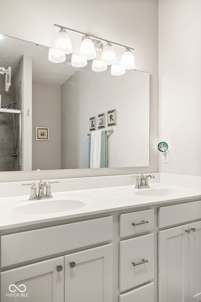 8842 Twain Ln, Indianapolis, IN 46239 - bathroom featuring double vanity and a tile shower