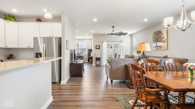 8842 Twain Ln, Indianapolis, IN 46239 - dining space with dark wood finished floors, recessed lighting, a ceiling fan, and a chandelier