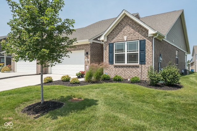 8842 Twain Ln, Indianapolis, IN 46239 - view of front facade with brick siding, an attached garage, driveway, a front yard, and roof with shingles