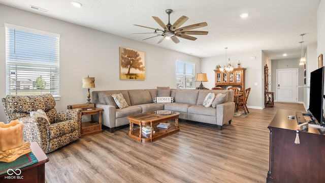 8842 Twain Ln, Indianapolis, IN 46239 - living area featuring a ceiling fan, light wood-type flooring, recessed lighting, and a chandelier