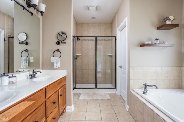 47 Torrey Pine Dr, Brownsburg, IN 46112 - bathroom with a shower stall, a garden tub, double vanity, and tile patterned floors