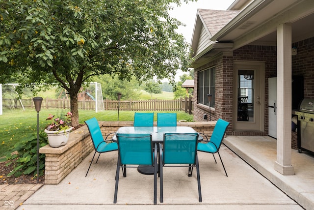 47 Torrey Pine Dr, Brownsburg, IN 46112 - fenced backyard with a patio, outdoor dining area, and area for grilling