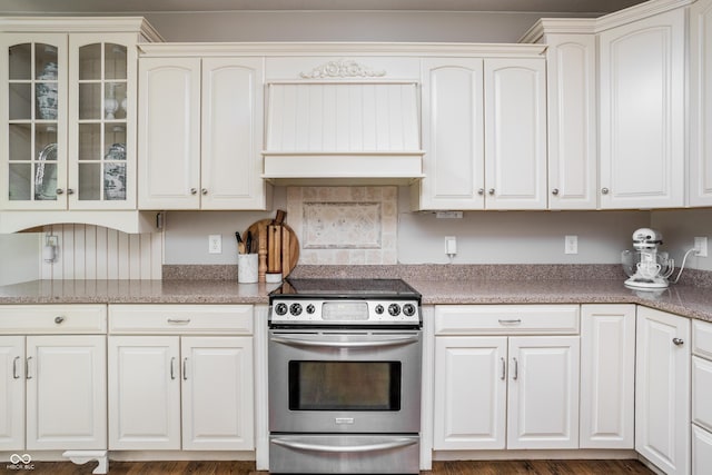 47 Torrey Pine Dr, Brownsburg, IN 46112 - kitchen with electric stove, premium range hood, glass insert cabinets, and white cabinetry
