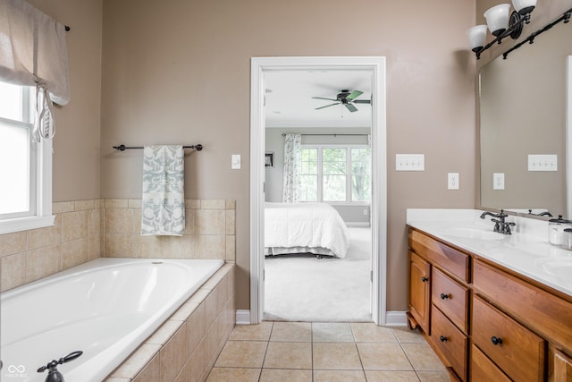 47 Torrey Pine Dr, Brownsburg, IN 46112 - bathroom featuring double vanity, a garden tub, tile patterned flooring, ceiling fan, and ensuite bath