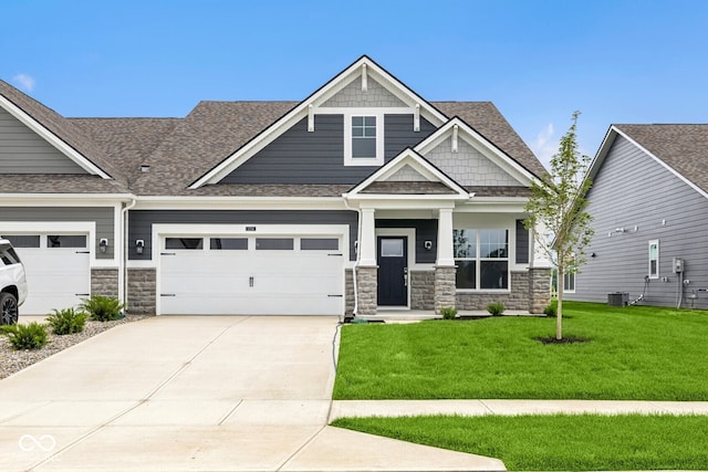 12516 Morning Ridge Way, Noblesville, IN 46060 - craftsman inspired home with stone siding, driveway, a front yard, and a shingled roof