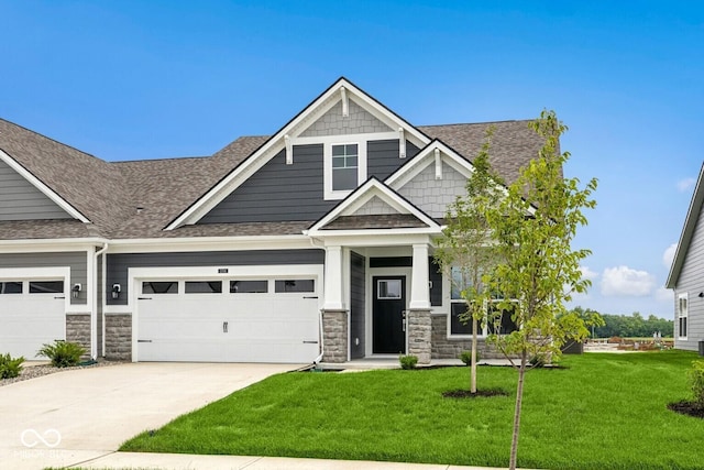 12516 Morning Ridge Way, Noblesville, IN 46060 - craftsman inspired home with stone siding, concrete driveway, a front lawn, and a garage