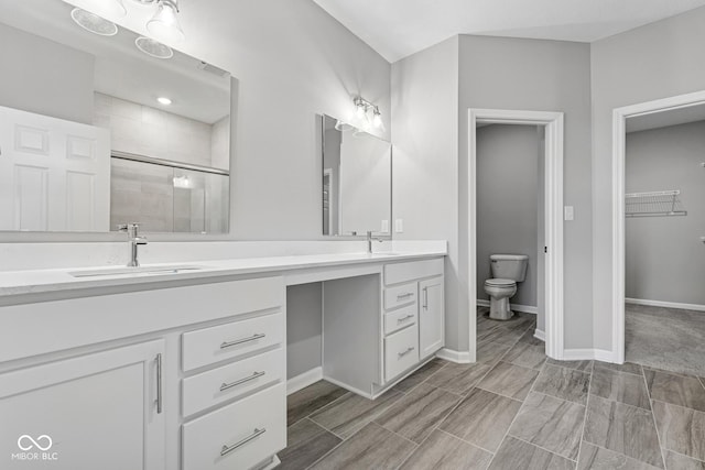 12516 Morning Ridge Way, Noblesville, IN 46060 - bathroom with double vanity, tiled shower, and a walk in closet