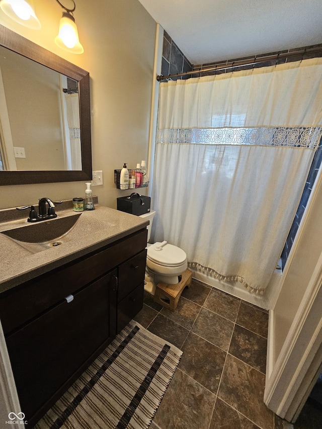 1510 Chester St, Anderson, IN 46012 - bathroom featuring vanity, stone finish floors, and a shower with shower curtain