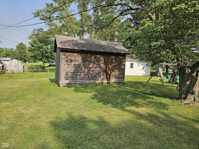 1510 Chester St, Anderson, IN 46012 - view of yard with a storage shed and a playground