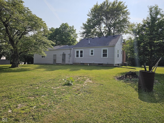 1510 Chester St, Anderson, IN 46012 - rear view of property with a lawn and a shingled roof