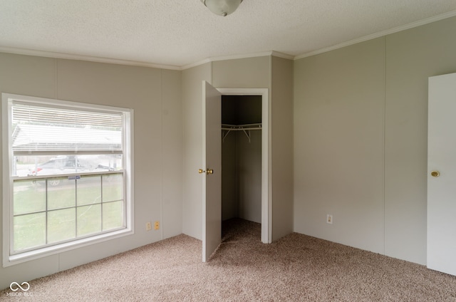 3149 Carson Ave, Indianapolis, IN 46227 - unfurnished bedroom with light carpet, ornamental molding, a textured ceiling, and a closet