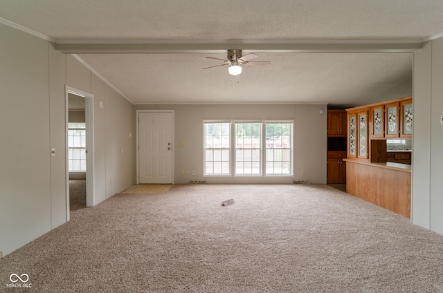 3149 Carson Ave, Indianapolis, IN 46227 - unfurnished living room featuring crown molding, carpet floors, ceiling fan, and a textured ceiling