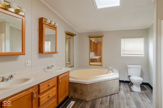 3149 Carson Ave, Indianapolis, IN 46227 - full bath featuring ornamental molding, wood finished floors, a garden tub, and double vanity