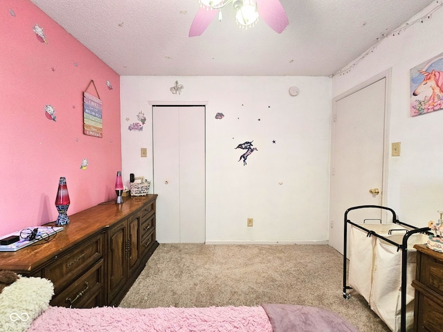 7906 States Bend Ln, Indianapolis, IN 46239 - bedroom featuring light colored carpet, a textured ceiling, ceiling fan, and a closet