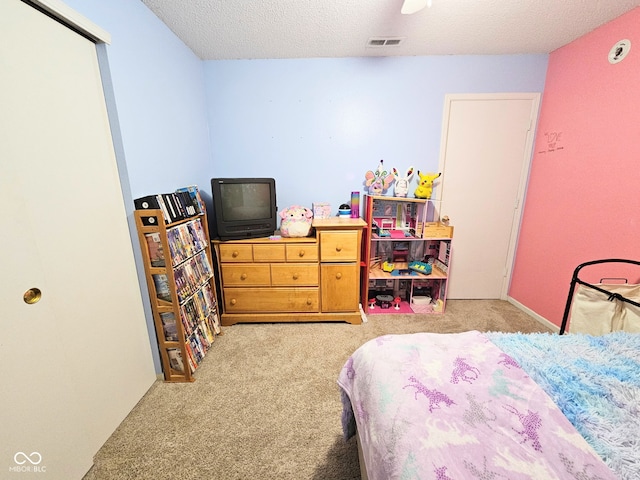 7906 States Bend Ln, Indianapolis, IN 46239 - bedroom featuring carpet flooring and a textured ceiling