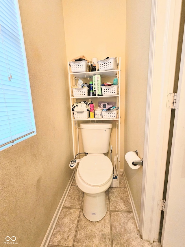 7906 States Bend Ln, Indianapolis, IN 46239 - bathroom with tile patterned flooring and toilet