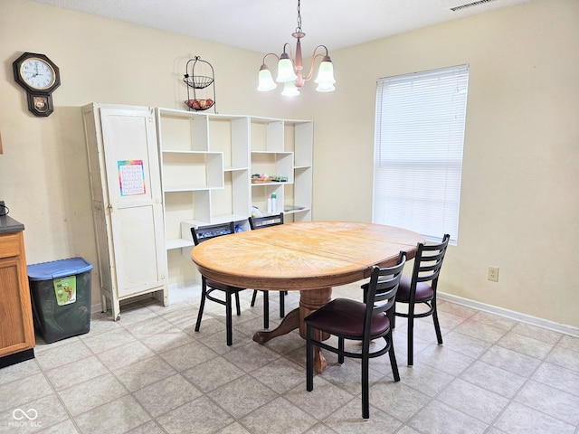 7906 States Bend Ln, Indianapolis, IN 46239 - dining area featuring a chandelier and baseboards