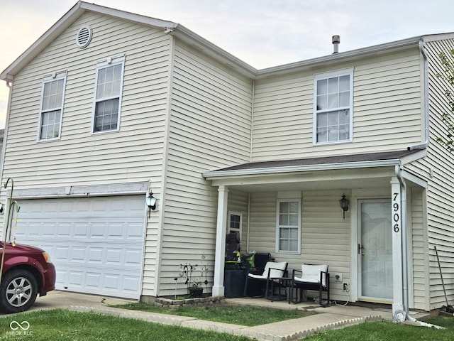 7906 States Bend Ln, Indianapolis, IN 46239 - view of front of property featuring covered porch and an attached garage