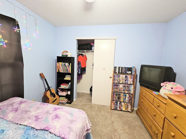 7906 States Bend Ln, Indianapolis, IN 46239 - bedroom featuring light colored carpet, a closet, and a textured ceiling