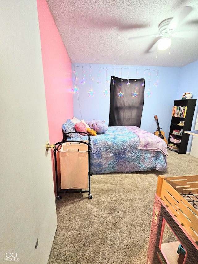 7906 States Bend Ln, Indianapolis, IN 46239 - bedroom featuring carpet flooring, a textured ceiling, and ceiling fan