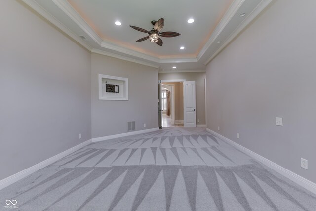 3795 Claybrook Ct, Bargersville, IN 46106 - spare room featuring a tray ceiling, ceiling fan, light colored carpet, recessed lighting, and crown molding