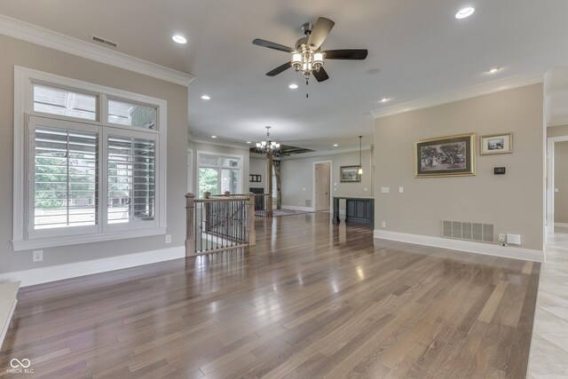 3795 Claybrook Ct, Bargersville, IN 46106 - unfurnished living room featuring recessed lighting, a chandelier, ornamental molding, light wood finished floors, and a ceiling fan