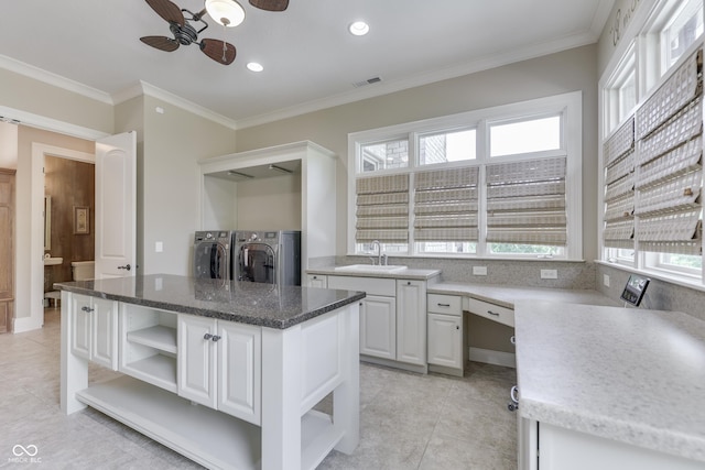 3795 Claybrook Ct, Bargersville, IN 46106 - kitchen featuring open shelves, washing machine and dryer, light tile patterned floors, ornamental molding, and recessed lighting
