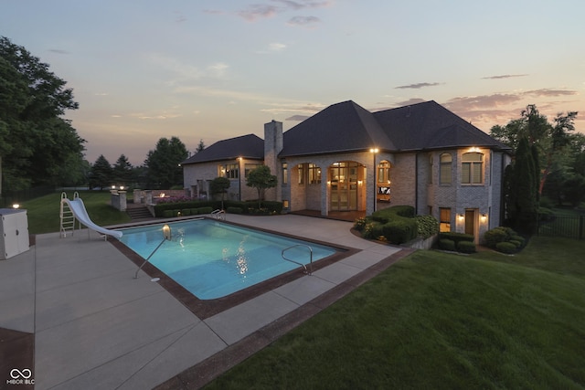 3795 Claybrook Ct, Bargersville, IN 46106 - pool at dusk with a water slide, a patio, and french doors