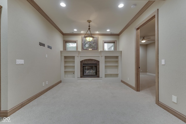 3795 Claybrook Ct, Bargersville, IN 46106 - unfurnished living room featuring crown molding, a high end fireplace, carpet flooring, recessed lighting, and ceiling fan