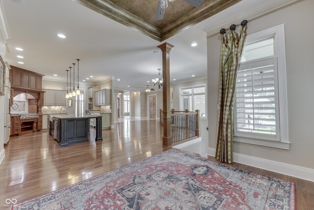 3795 Claybrook Ct, Bargersville, IN 46106 - living room with crown molding, light wood finished floors, ornate columns, and recessed lighting