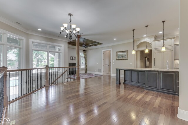 3795 Claybrook Ct, Bargersville, IN 46106 - kitchen featuring a chandelier, wood finished floors, crown molding, recessed lighting, and hanging light fixtures