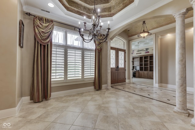 3795 Claybrook Ct, Bargersville, IN 46106 - entryway with arched walkways, a tray ceiling, a chandelier, ornate columns, and ornamental molding