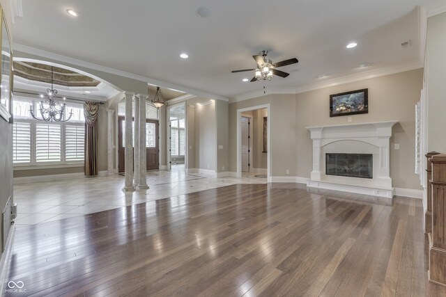 3795 Claybrook Ct, Bargersville, IN 46106 - unfurnished living room with decorative columns, ornamental molding, healthy amount of natural light, wood-type flooring, and recessed lighting