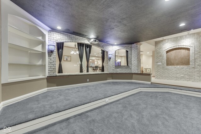 3795 Claybrook Ct, Bargersville, IN 46106 - community lobby featuring a textured ceiling, brick wall, and recessed lighting
