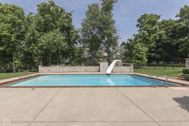 3795 Claybrook Ct, Bargersville, IN 46106 - view of swimming pool with a water slide, a patio, and view of wooded area