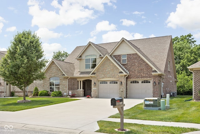 5194 Orahood Ct, Plainfield, IN 46168 - view of front of property featuring stone siding, driveway, a front yard, a shingled roof, and an attached garage