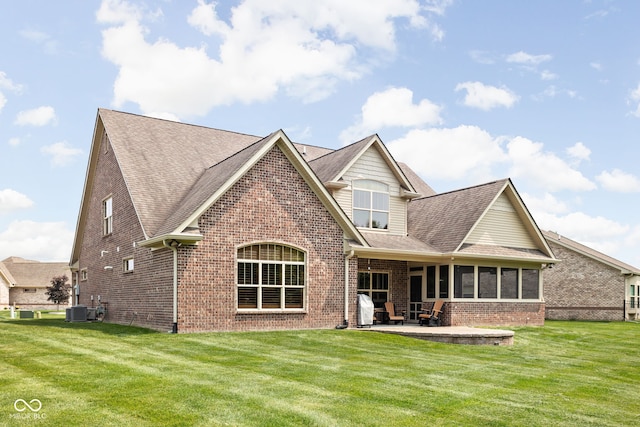 5194 Orahood Ct, Plainfield, IN 46168 - back of house with brick siding, a patio area, a sunroom, and roof with shingles