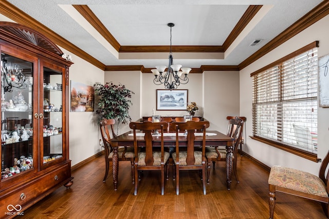 5194 Orahood Ct, Plainfield, IN 46168 - dining area featuring a raised ceiling, a chandelier, wood finished floors, and crown molding