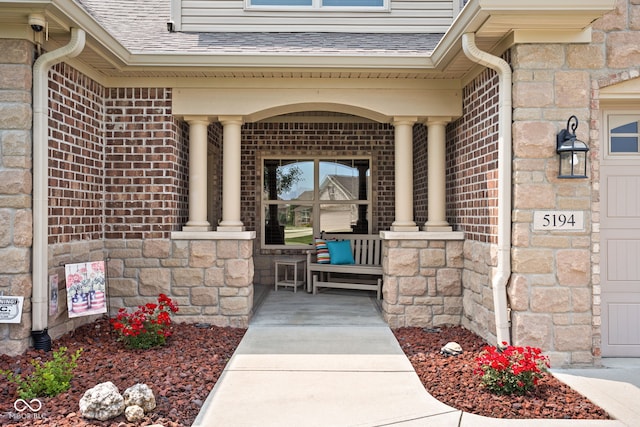 5194 Orahood Ct, Plainfield, IN 46168 - entrance to property featuring covered porch, brick siding, stone siding, and a shingled roof