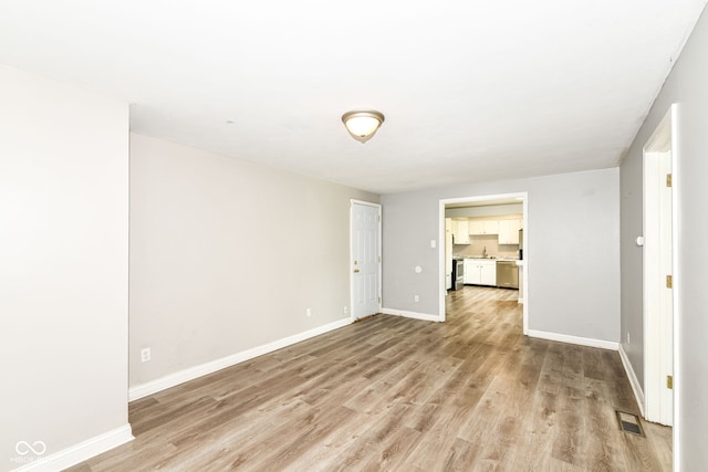 1543 W 79th St, Indianapolis, IN 46260 - empty room with light wood-style flooring and baseboards