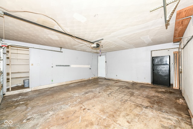 1543 W 79th St, Indianapolis, IN 46260 - garage featuring freestanding refrigerator and a garage door opener